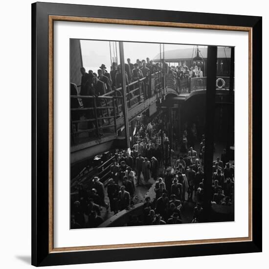 Ferry Boat Commuters from Staten Island Disembarking at Ferry Slip in Manhattan-Andreas Feininger-Framed Photographic Print