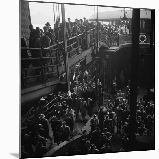 Ferry Boat Commuters from Staten Island Disembarking at Ferry Slip in Manhattan-Andreas Feininger-Mounted Photographic Print