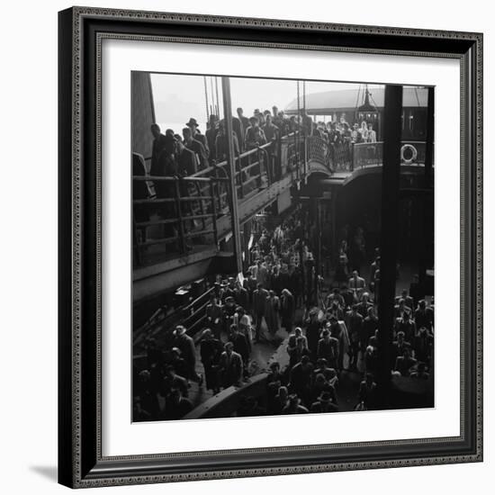 Ferry Boat Commuters from Staten Island Disembarking at Ferry Slip in Manhattan-Andreas Feininger-Framed Photographic Print