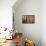 Fez Morocco decorative door and hanging patterned carpets in the old medina-Ellen Clark-Framed Premier Image Canvas displayed on a wall