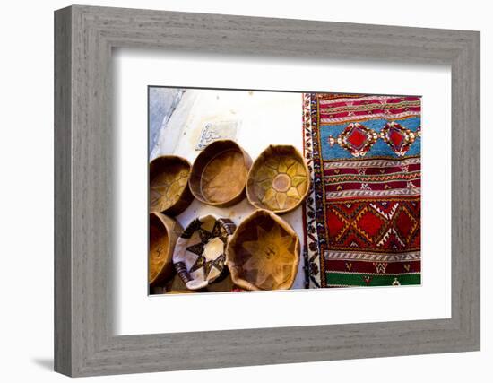 Fez Morocco leather baskets & oriental carpet on the wall in the old medina-Ellen Clark-Framed Photographic Print