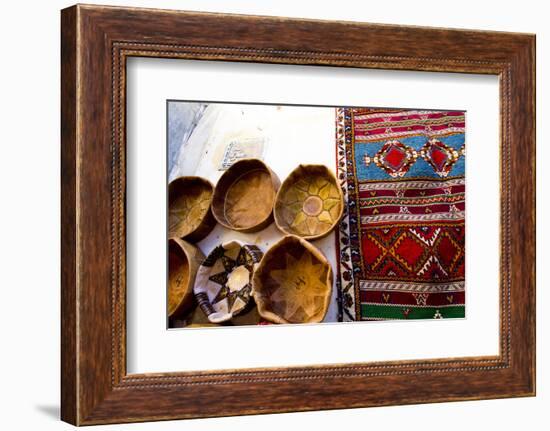 Fez Morocco leather baskets & oriental carpet on the wall in the old medina-Ellen Clark-Framed Photographic Print