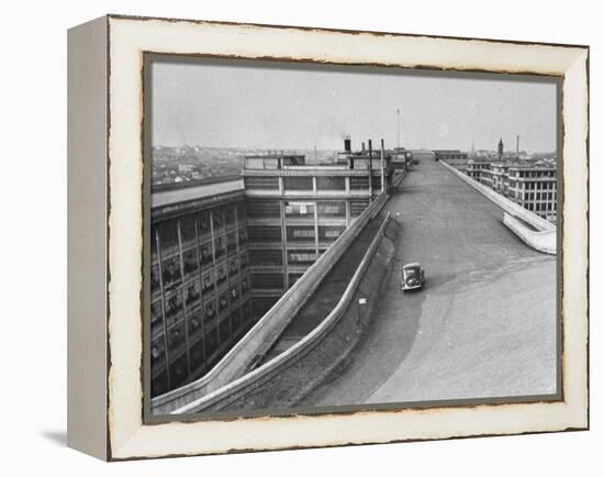 Fiat Car Driving Along the Desolate Street-Carl Mydans-Framed Premier Image Canvas