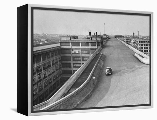 Fiat Car Driving Along the Desolate Street-Carl Mydans-Framed Premier Image Canvas