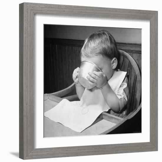 Fifteen Mo. Old Baby Demonstrates How He Can Now Drink from a Cup Even Though It is a Bit Sloppy-Nina Leen-Framed Photographic Print