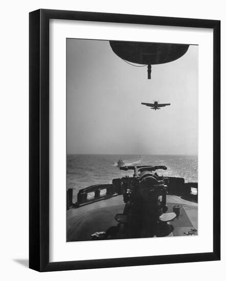 Fighter Plane Coming in for a Landing onto Flight Deck of a US Navy Carrier-null-Framed Photographic Print