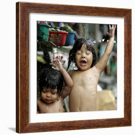 Filipino Children React as They Get a Shower Outside Their Homes-null-Framed Photographic Print