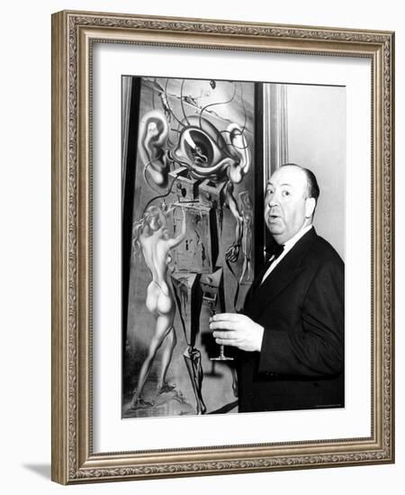 Film Director Alfred Hitchcock, Standing Beside Salvador Dali's Painting "Movies"-Herbert Gehr-Framed Premium Photographic Print