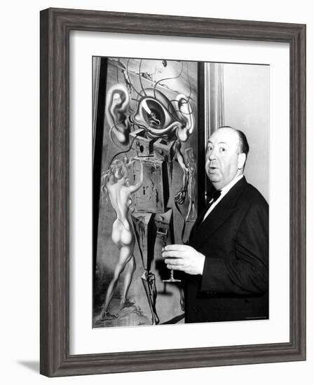 Film Director Alfred Hitchcock, Standing Beside Salvador Dali's Painting "Movies"-Herbert Gehr-Framed Premium Photographic Print