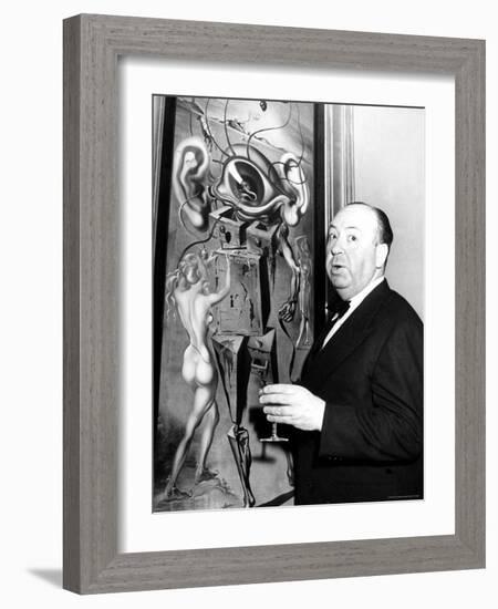 Film Director Alfred Hitchcock, Standing Beside Salvador Dali's Painting "Movies"-Herbert Gehr-Framed Premium Photographic Print