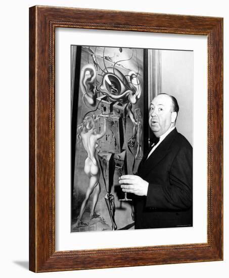 Film Director Alfred Hitchcock, Standing Beside Salvador Dali's Painting "Movies"-Herbert Gehr-Framed Premium Photographic Print