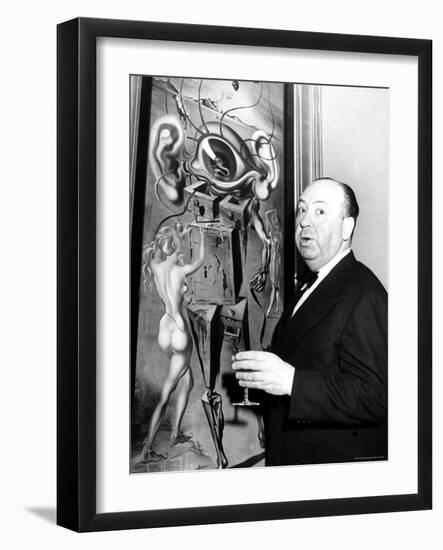 Film Director Alfred Hitchcock, Standing Beside Salvador Dali's Painting "Movies"-Herbert Gehr-Framed Premium Photographic Print