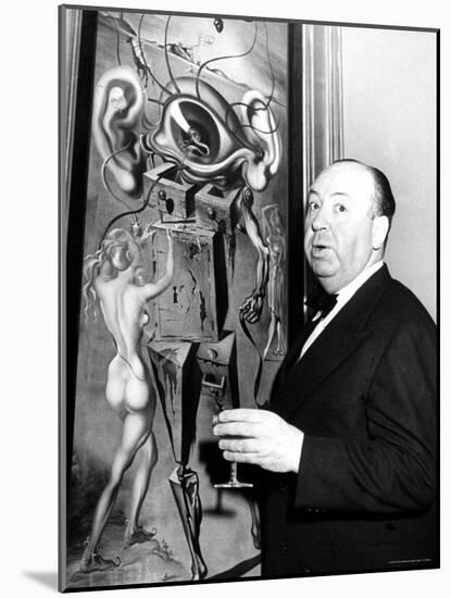 Film Director Alfred Hitchcock, Standing Beside Salvador Dali's Painting "Movies"-Herbert Gehr-Mounted Premium Photographic Print