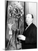 Film Director Alfred Hitchcock, Standing Beside Salvador Dali's Painting "Movies"-Herbert Gehr-Mounted Premium Photographic Print