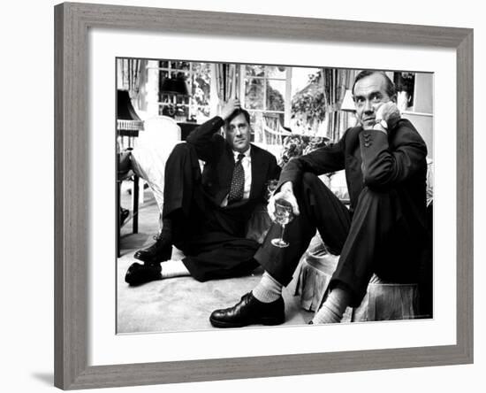 Film Director Carol Reed and Author Graham Greene Sitting on the Floor with Wine Glasses-Larry Burrows-Framed Premium Photographic Print