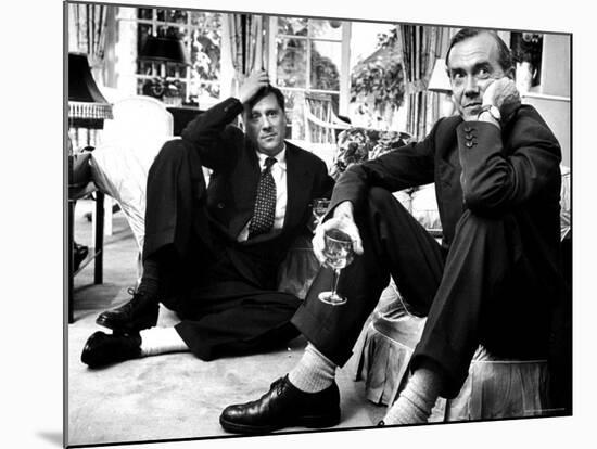 Film Director Carol Reed and Author Graham Greene Sitting on the Floor with Wine Glasses-Larry Burrows-Mounted Premium Photographic Print