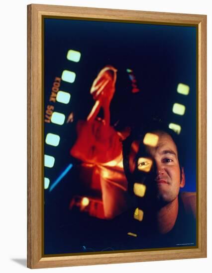 Film Director Quentin Tarantino Framed by Projected Clip From His Movie "Pulp Fiction"-Ted Thai-Framed Premier Image Canvas