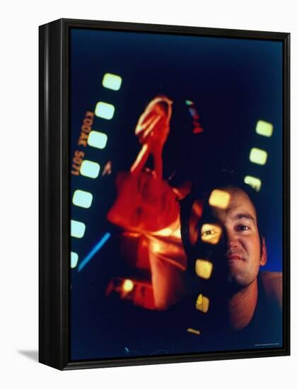 Film Director Quentin Tarantino Framed by Projected Clip From His Movie "Pulp Fiction"-Ted Thai-Framed Premier Image Canvas