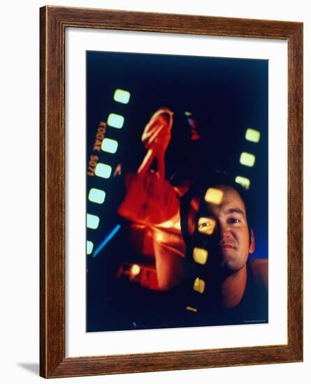 Film Director Quentin Tarantino Framed by Projected Clip From His Movie "Pulp Fiction"-Ted Thai-Framed Premium Photographic Print