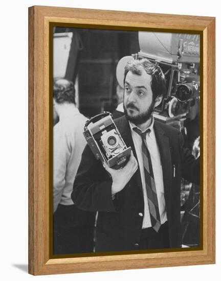 Film Director Stanley Kubrick Holding Polaroid Camera During Filming of "2001: A Space Odyssey"-Dmitri Kessel-Framed Premier Image Canvas