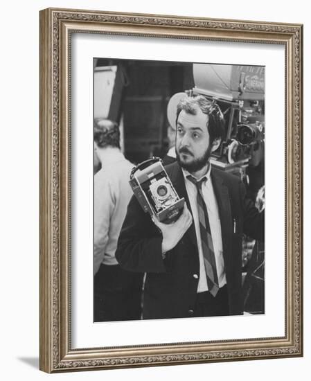 Film Director Stanley Kubrick Holding Polaroid Camera During Filming of "2001: A Space Odyssey"-Dmitri Kessel-Framed Premium Photographic Print