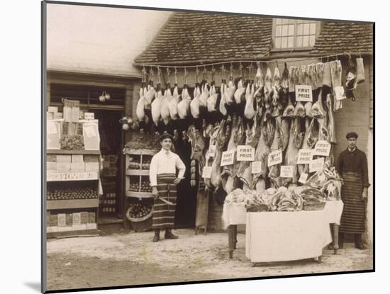 Fine Display of Meat Displayed Outside a Butcher's Shop-null-Mounted Photographic Print