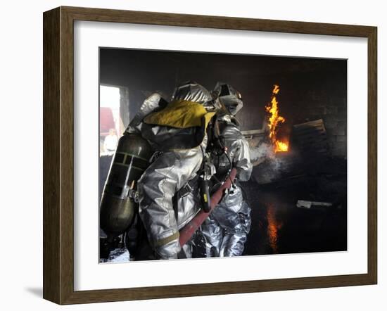 Firefighters Extinguish a Fire in a Training Room During Live Burn Training-Stocktrek Images-Framed Photographic Print