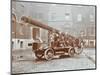 Firemen Aboard a Motor Fire Escape Vehicle, London Fire Brigade Headquarters, London, 1909-null-Mounted Photographic Print