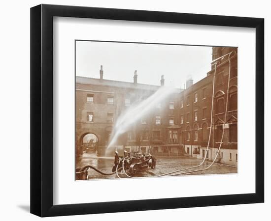 Firemen Demonstrating Hoses Worked by a Petrol Motor Pump, London Fire Brigade Headquarters, 1909-null-Framed Photographic Print