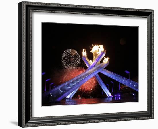 Fireworks Explode Behind the Olympic Flame at Opening Ceremony of Vancouver 2010 Winter Games-null-Framed Photographic Print