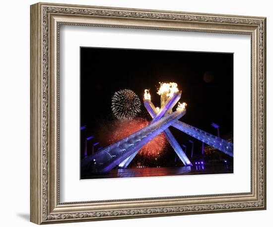 Fireworks Explode Behind the Olympic Flame at Opening Ceremony of Vancouver 2010 Winter Games-null-Framed Photographic Print