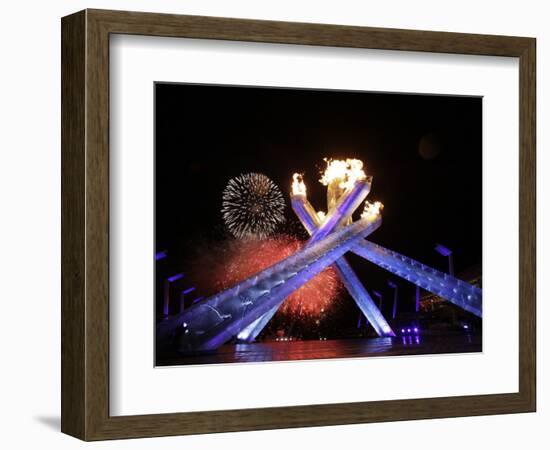 Fireworks Explode Behind the Olympic Flame at Opening Ceremony of Vancouver 2010 Winter Games-null-Framed Photographic Print