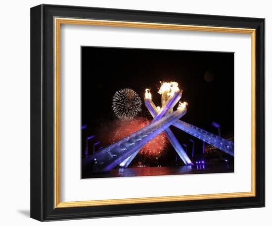 Fireworks Explode Behind the Olympic Flame at Opening Ceremony of Vancouver 2010 Winter Games-null-Framed Photographic Print