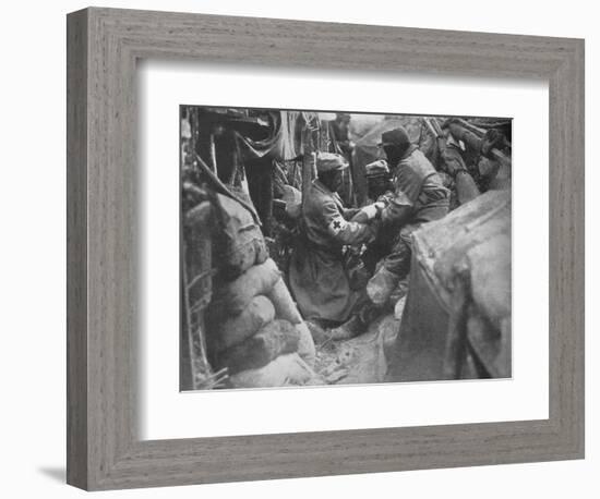 'First aid to a wounded man in one of the French trenches', 1915-Unknown-Framed Photographic Print