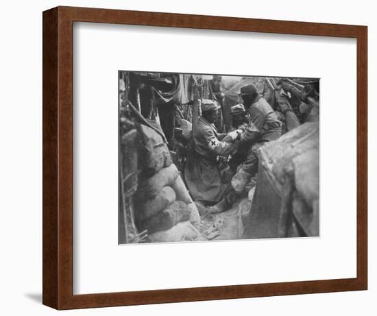 'First aid to a wounded man in one of the French trenches', 1915-Unknown-Framed Photographic Print