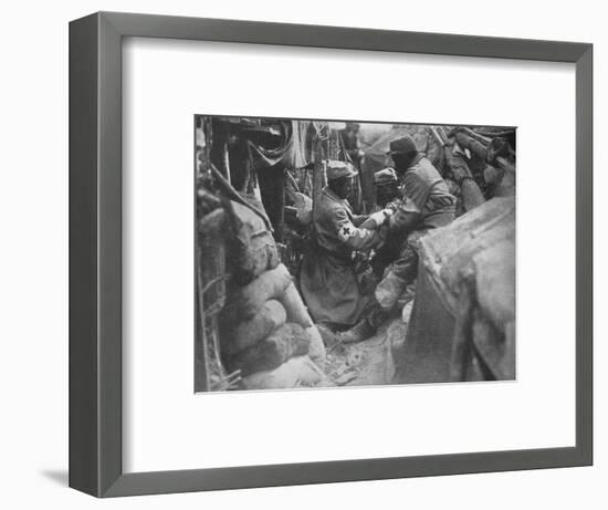 'First aid to a wounded man in one of the French trenches', 1915-Unknown-Framed Photographic Print