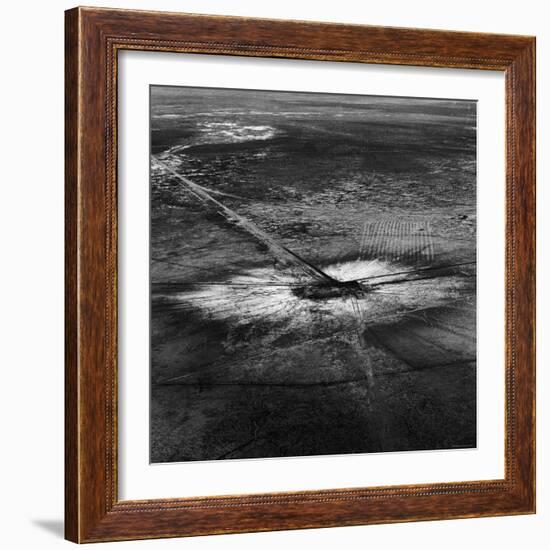 First Atomic Bomb's Dark Crater Surrounded by Glass Created by Heated Sand from Explosion-Fritz Goro-Framed Photographic Print