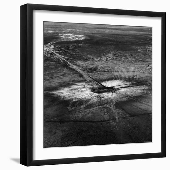 First Atomic Bomb's Dark Crater Surrounded by Glass Created by Heated Sand from Explosion-Fritz Goro-Framed Photographic Print