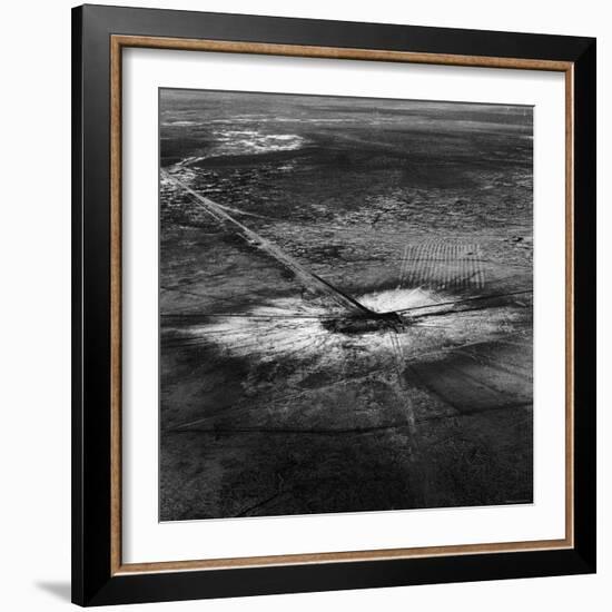 First Atomic Bomb's Dark Crater Surrounded by Glass Created by Heated Sand from Explosion-Fritz Goro-Framed Photographic Print