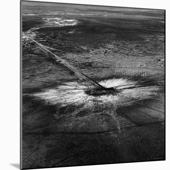 First Atomic Bomb's Dark Crater Surrounded by Glass Created by Heated Sand from Explosion-Fritz Goro-Mounted Photographic Print