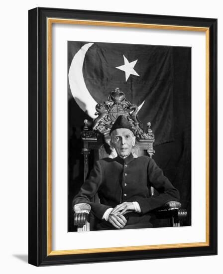 First Gov. Gen. of Independent Pakistan Mohammed Ali Jinnah Sitting in Front of Pakistani Flag-Margaret Bourke-White-Framed Photographic Print