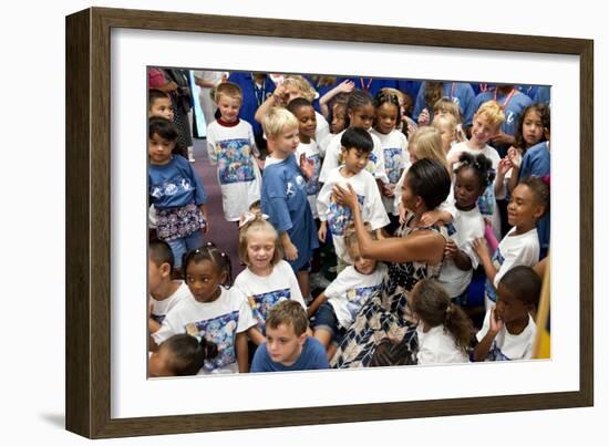 First Lady Michelle Obama Greets Children at Naval Air Station Oceana Summer Camp-null-Framed Photo