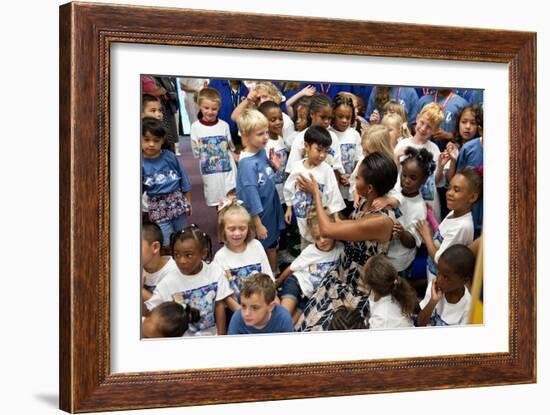 First Lady Michelle Obama Greets Children at Naval Air Station Oceana Summer Camp-null-Framed Photo