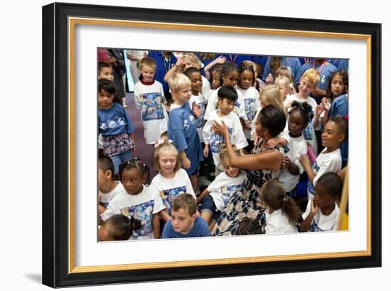 First Lady Michelle Obama Greets Children at Naval Air Station Oceana Summer Camp-null-Framed Photo