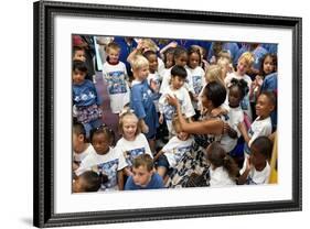 First Lady Michelle Obama Greets Children at Naval Air Station Oceana Summer Camp-null-Framed Photo
