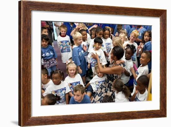 First Lady Michelle Obama Greets Children at Naval Air Station Oceana Summer Camp-null-Framed Photo