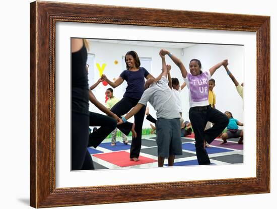 First Lady Michelle Obama Joins an after School 'Let's Move!' Yoga Class after School Activities-null-Framed Premium Photographic Print