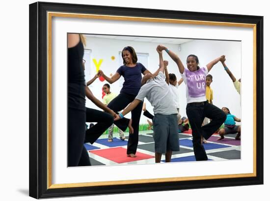 First Lady Michelle Obama Joins an after School 'Let's Move!' Yoga Class after School Activities-null-Framed Premium Photographic Print