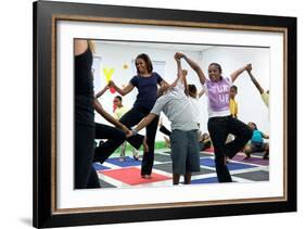 First Lady Michelle Obama Joins an after School 'Let's Move!' Yoga Class after School Activities-null-Framed Photo