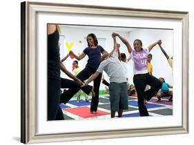 First Lady Michelle Obama Joins an after School 'Let's Move!' Yoga Class after School Activities-null-Framed Photo